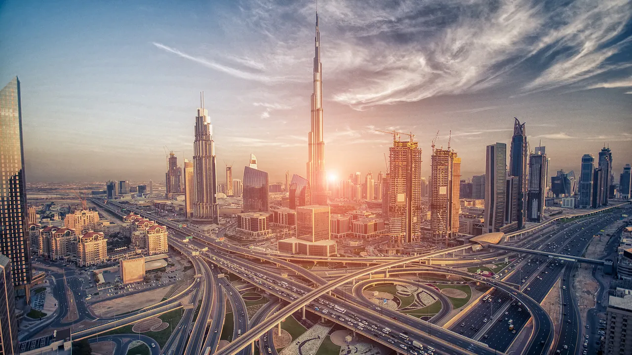 Dubai skyline at sunset with Sheikh Zayed Road interchanges — Rafi Group is headquartered in Business Bay, Dubai